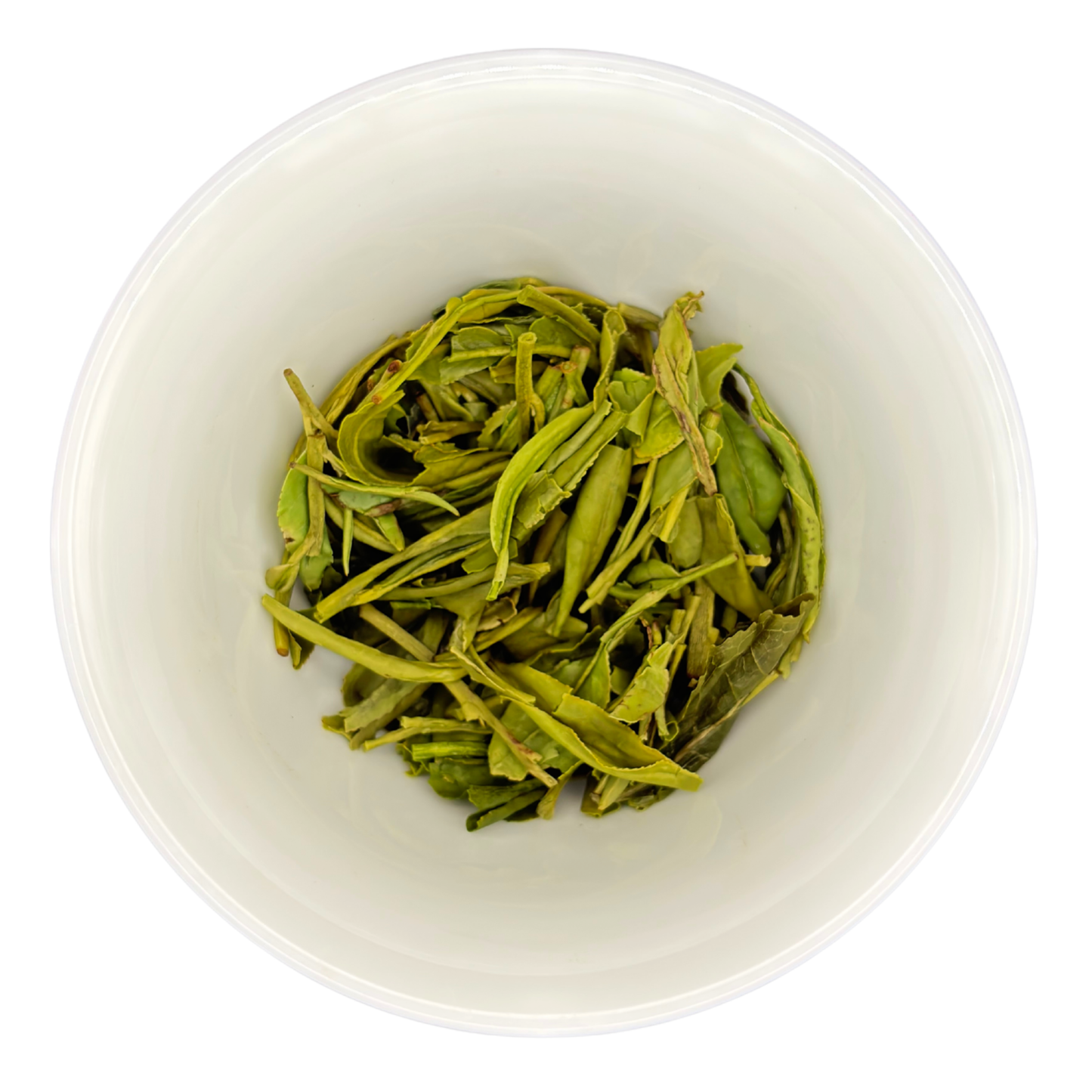Dragonwell tea leaves in a white bowl on a white background