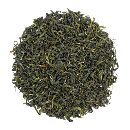 Pile of green jade tea leaves on a white background