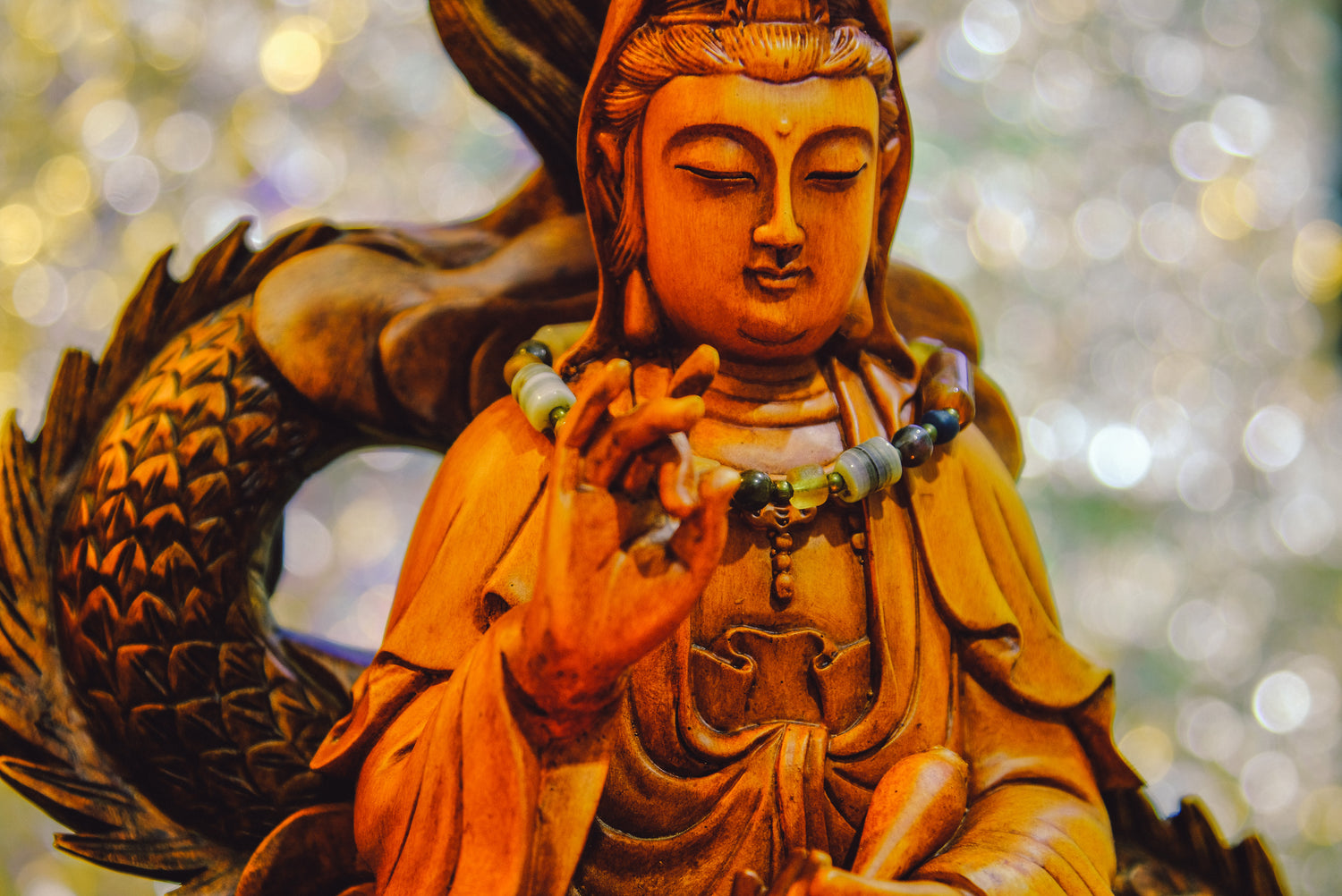 a wooden statue of Guanyin, the Goddess of Mercy