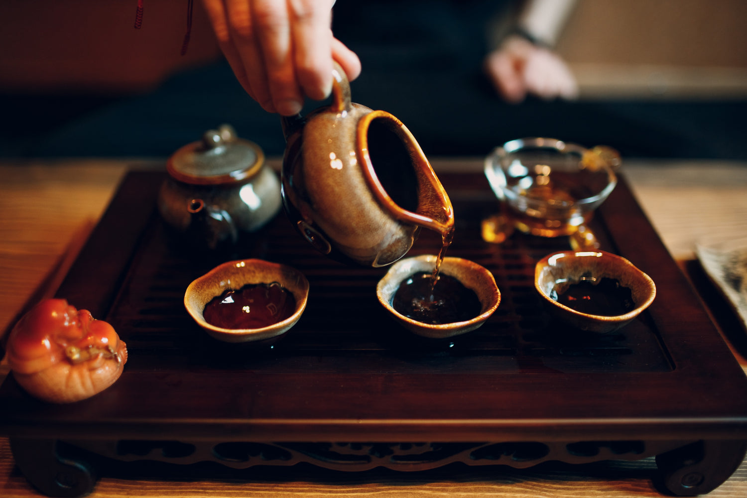 3 cups of ripe pu'erh tea being served